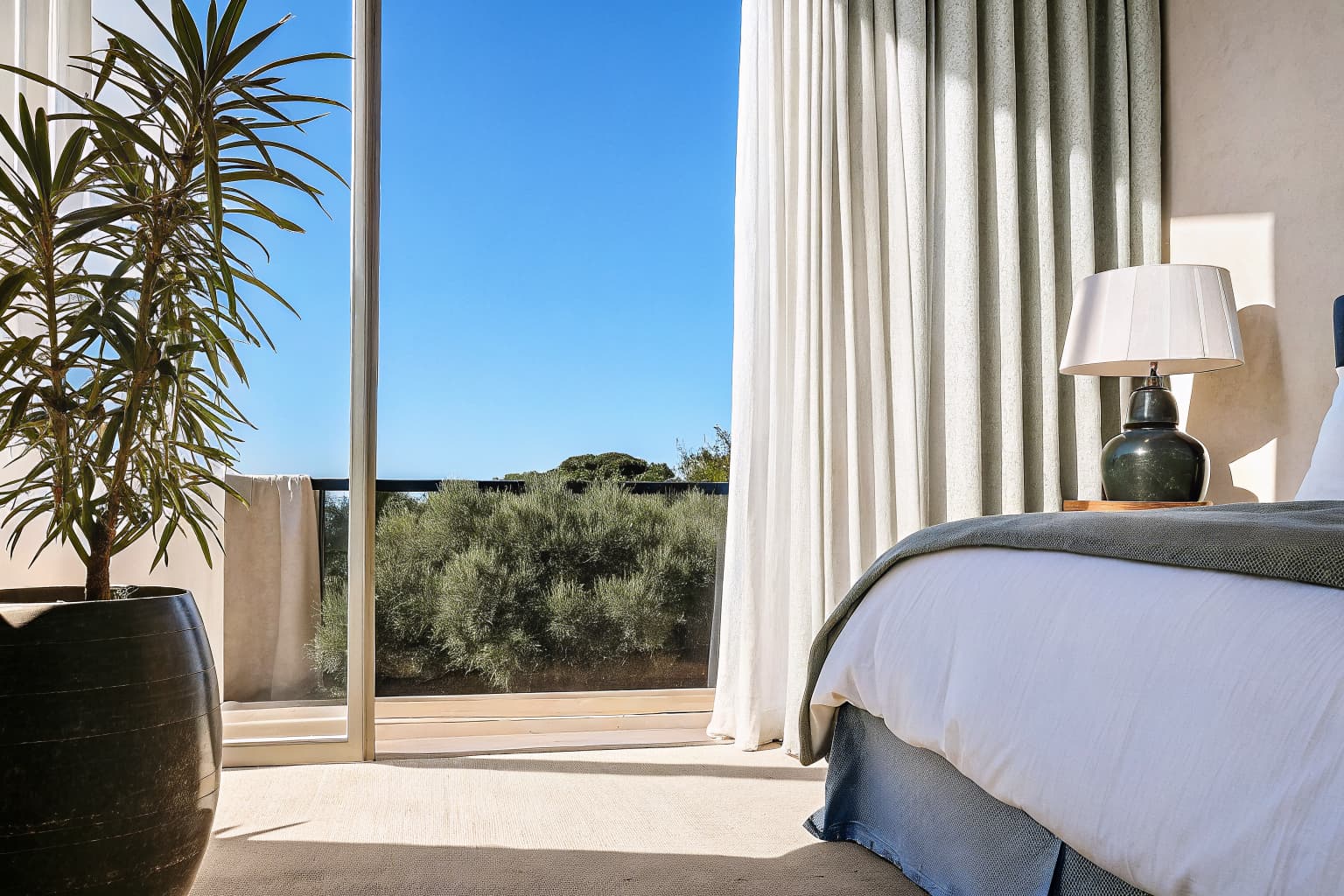 Serene bedroom with soft natural light, flowing curtains, and calm yin energy atmosphere
